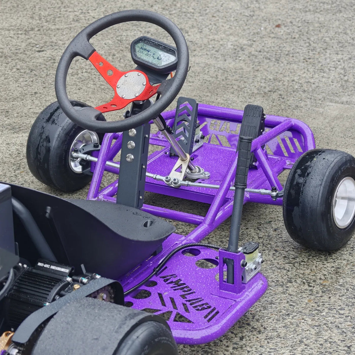 Cockpit with racing wheel, LCD dash, pedals and vertical handbrake